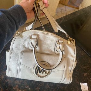 Brand new (tags not on bag). Never carried.